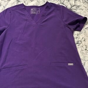 Used women’s figs uniform top